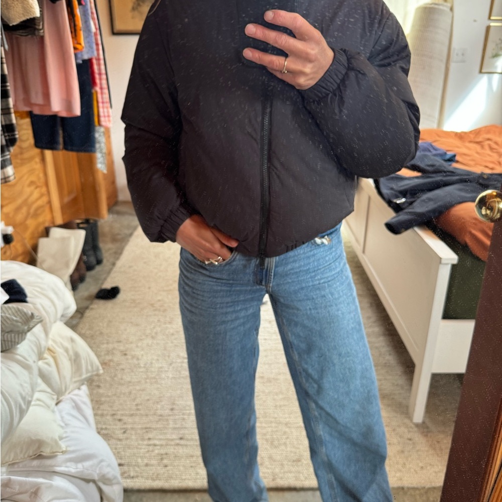 Black Puffer Jacket with Blue Jeans